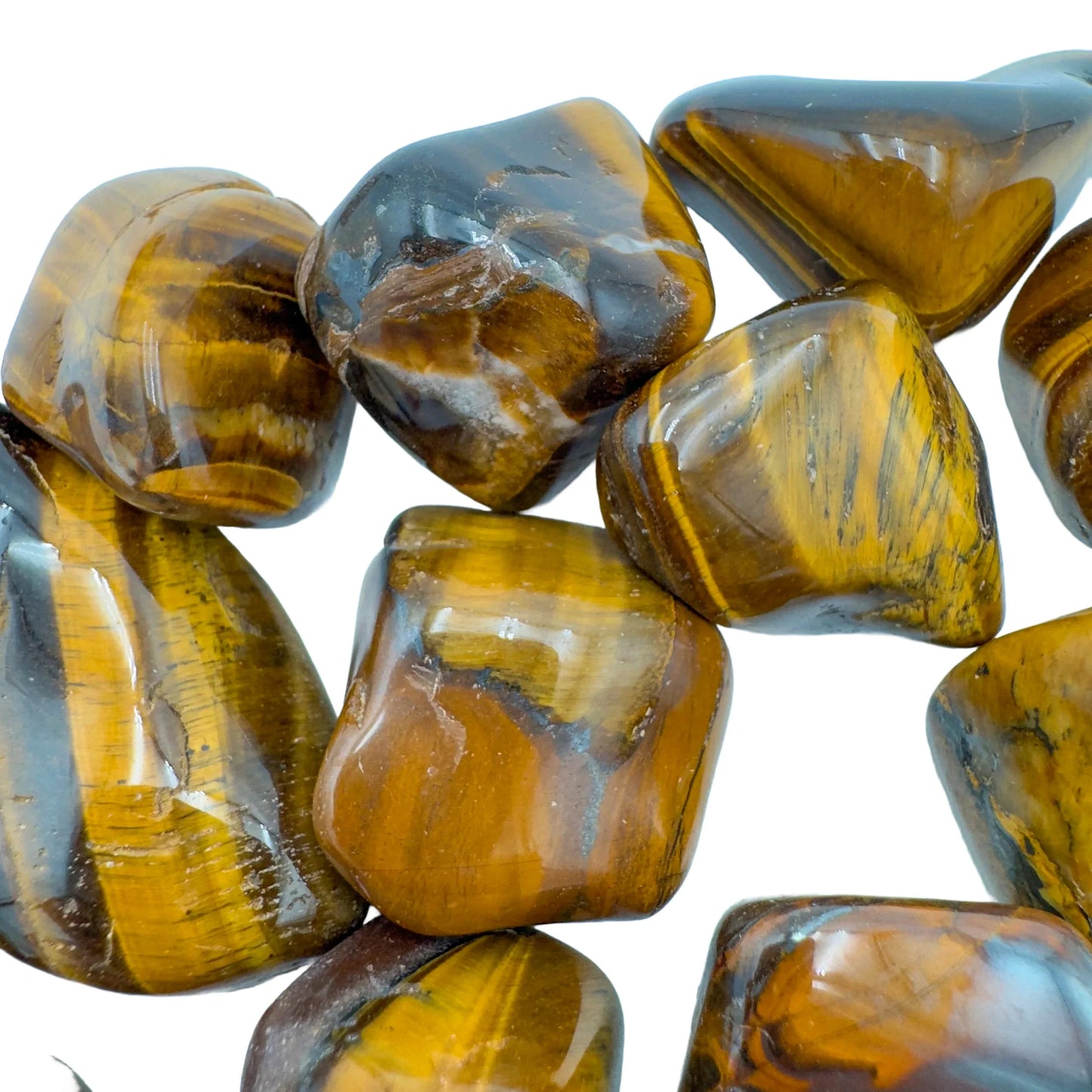 Palm-scale view of a Tiger Eye tumbled stone turned to for Confidence, from South Africa.
