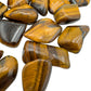 Aerial view of brown Tiger Eye tumbled stone, for Confidence.