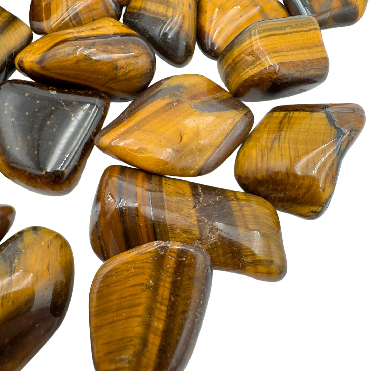 Aerial view of brown Tiger Eye tumbled stone, for Confidence.