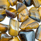 Reverse angle of Grade A Tiger Eye tumbled stone, sourced from South Africa.