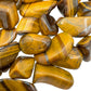 Profile shot of Tiger Eye tumbled stone, showing natural sheen.
