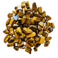 Detail shot of Grade A Tiger Eye tumbled stone under natural light