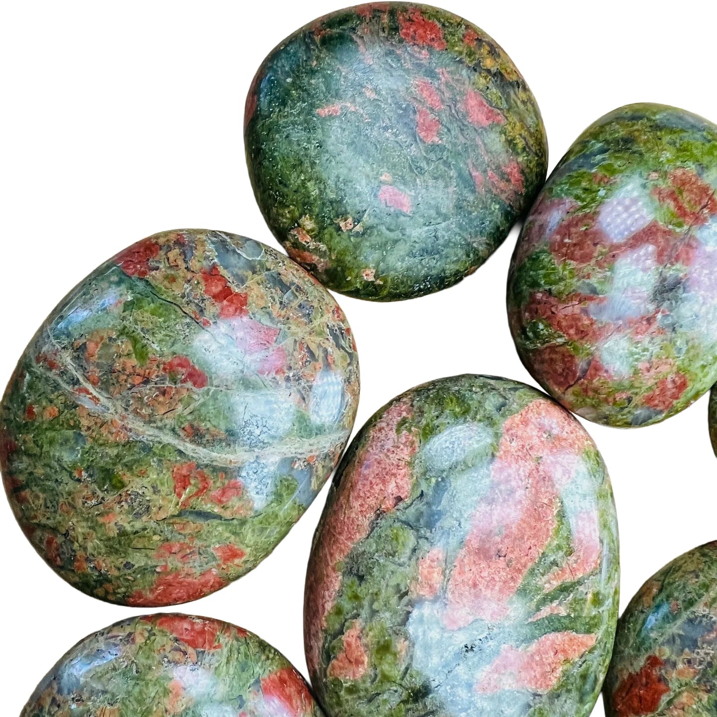 Side perspective of Unakite palm stone, traditionally used for Emotional Healing.