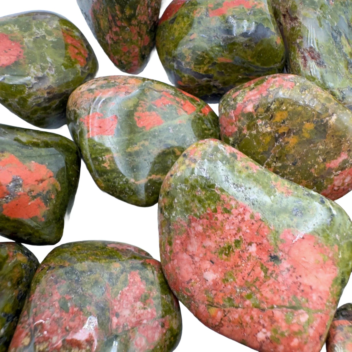 Underside detail of Unakite tumbled stone, showing natural sheen, turned to for Emotional Healing.