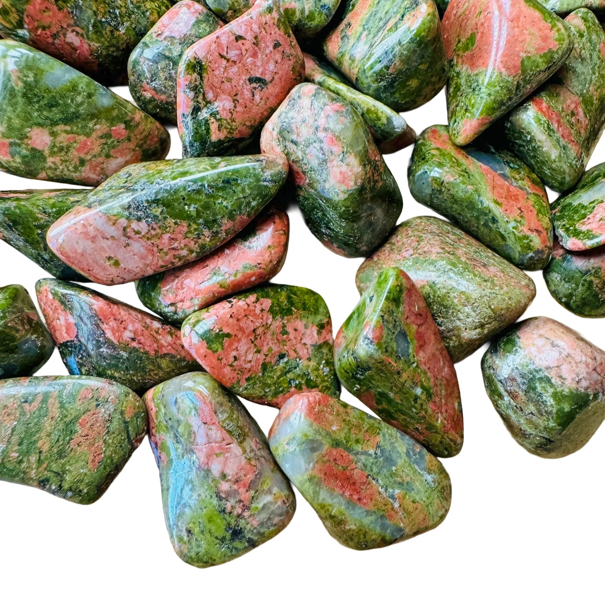 Close-up of Grade AA Unakite tumbled stone, showing characteristic color, hand-selected from Northern Cape, South Africa.