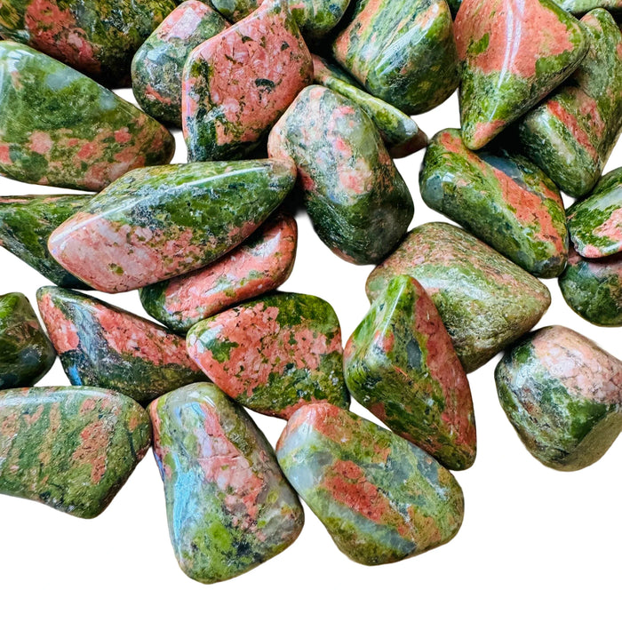 Close-up of Grade AA Unakite tumbled stone, showing characteristic color, hand-selected from Northern Cape, South Africa.