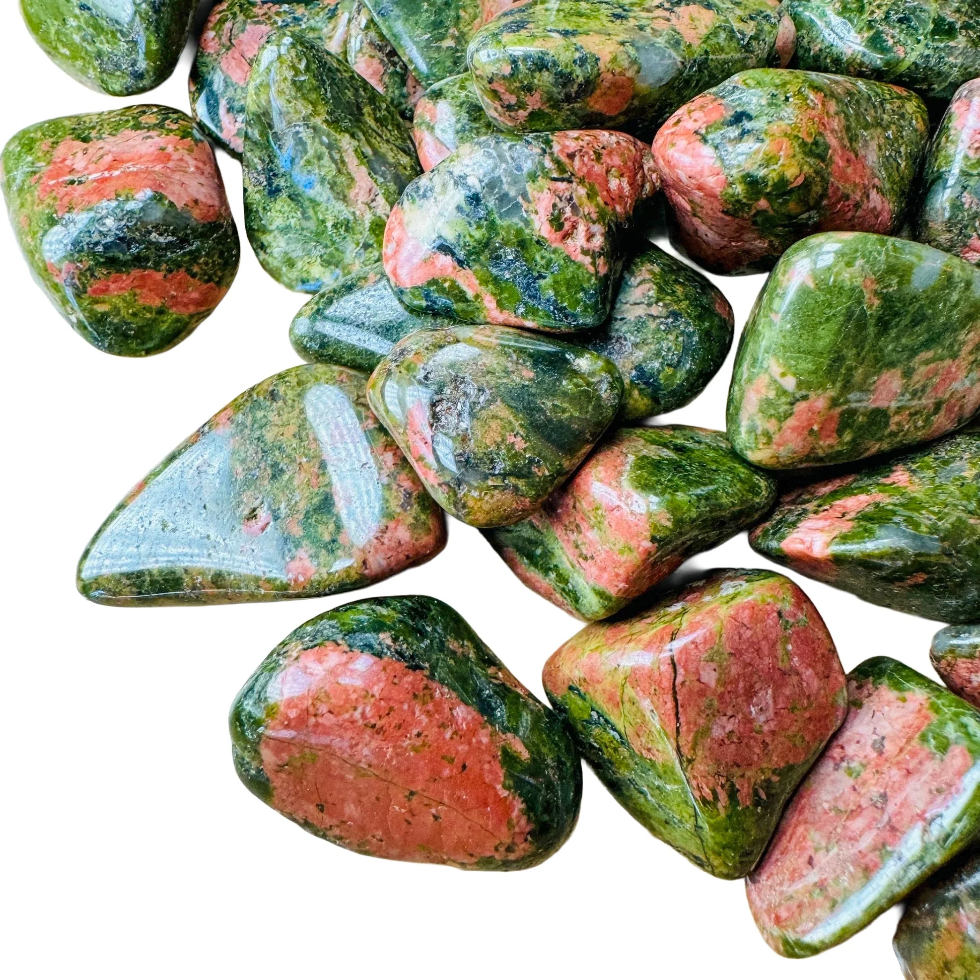 Profile shot of Unakite tumbled stone, kept close for Emotional Healing, showing natural variation.