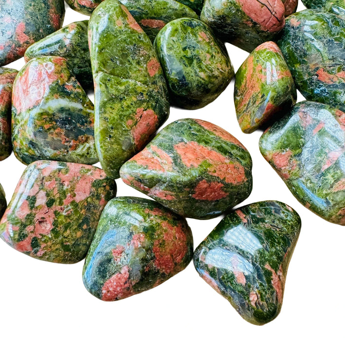 Close detail of Grade AA green Unakite tumbled stone, South Africa-sourced.