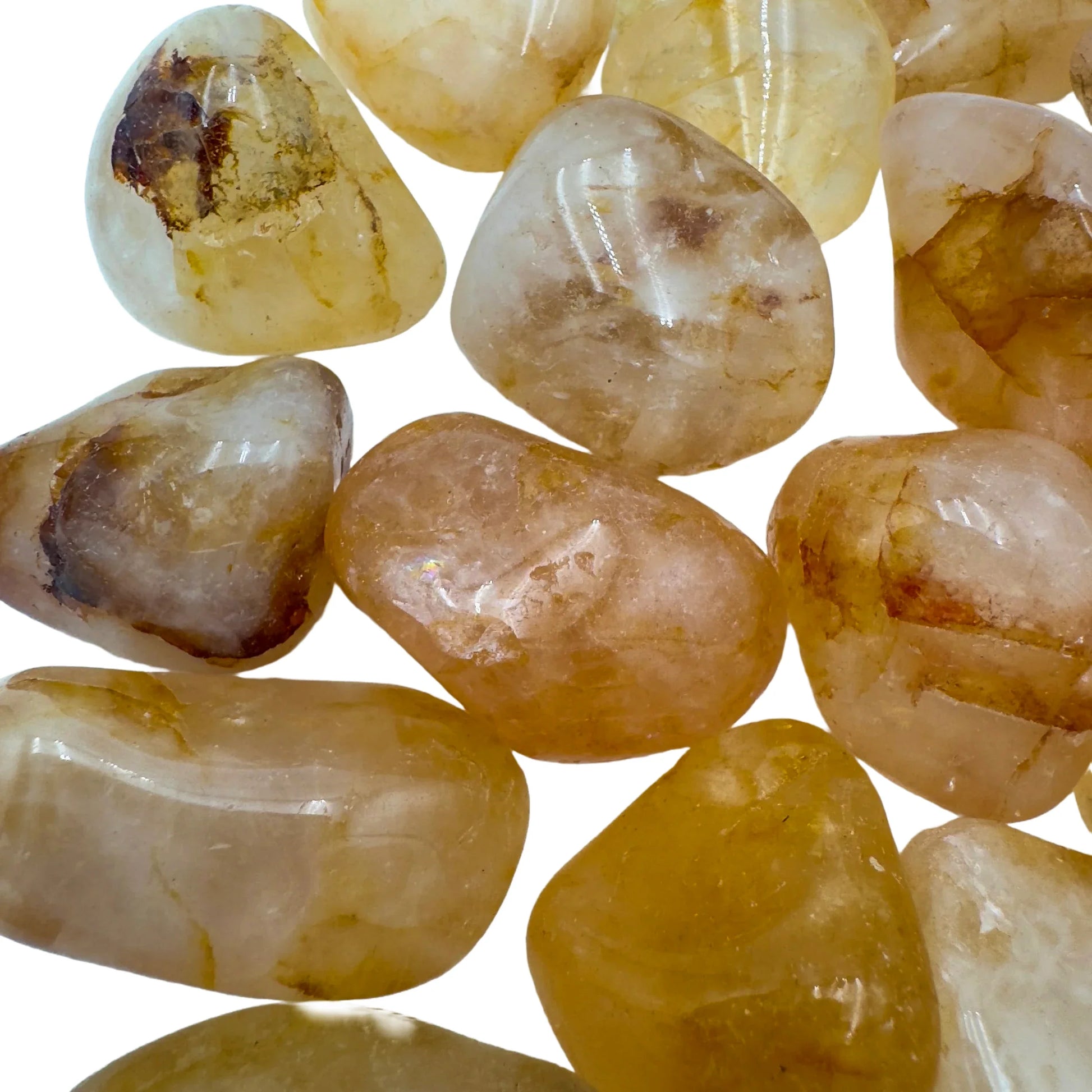 Aerial view of yellow Golden Healer tumbled stone, often paired with practices around Healing, showing characteristic color.