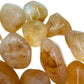 Palm-scale view of a Golden Healer tumbled stone, from Madagascar.