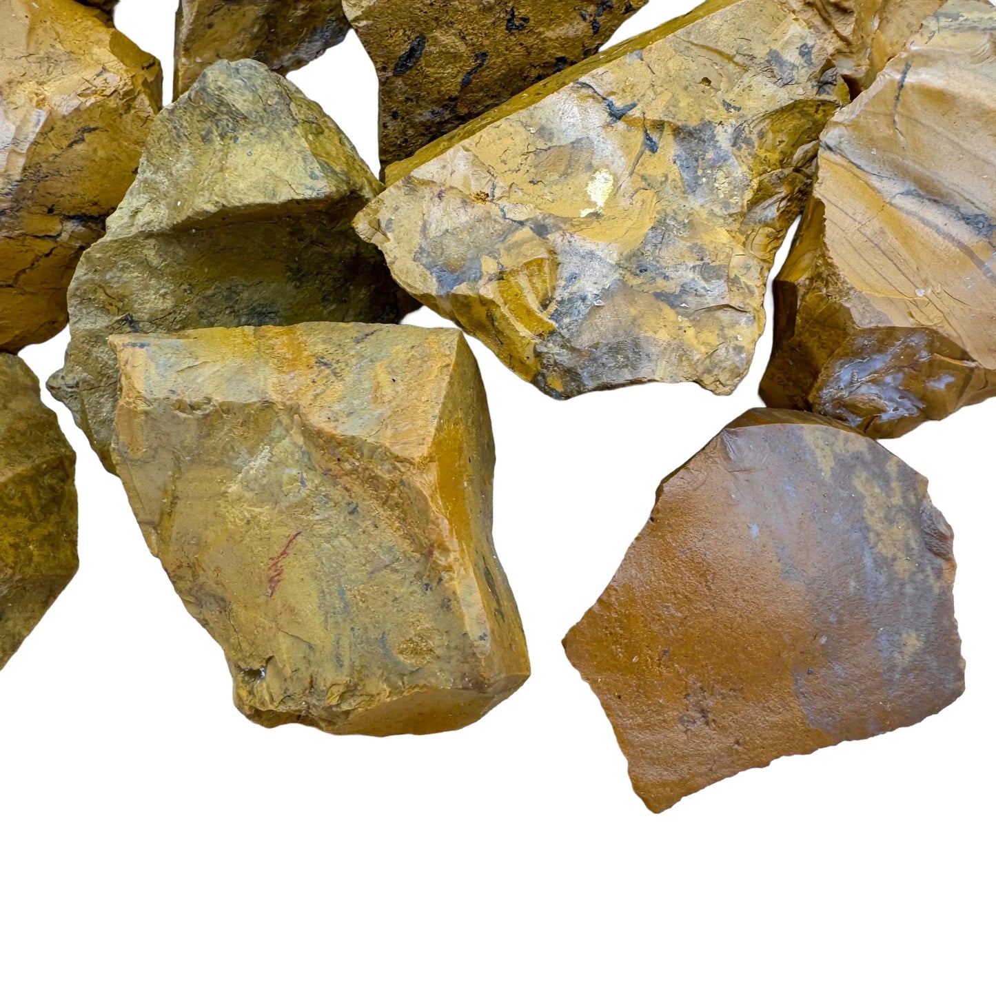 Edge view of Grade AA Yellow Jasper raw stone, sourced from Sofia, Madagascar, showing natural texture.