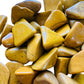 Aerial view of Grade AA Yellow Jasper tumbled stone, showing characteristic color, sourced from Madagascar.