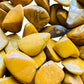 Reverse side of Yellow Jasper tumbled stone, showing translucent edges, sourced from Sofia, Madagascar.