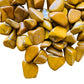 Natural light view of one Yellow Jasper tumbled stone for scale, sourced from Madagascar.
