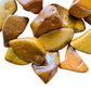 Macro view of Yellow Jasper tumbled stone, showing soft luster, Madagascar-sourced.