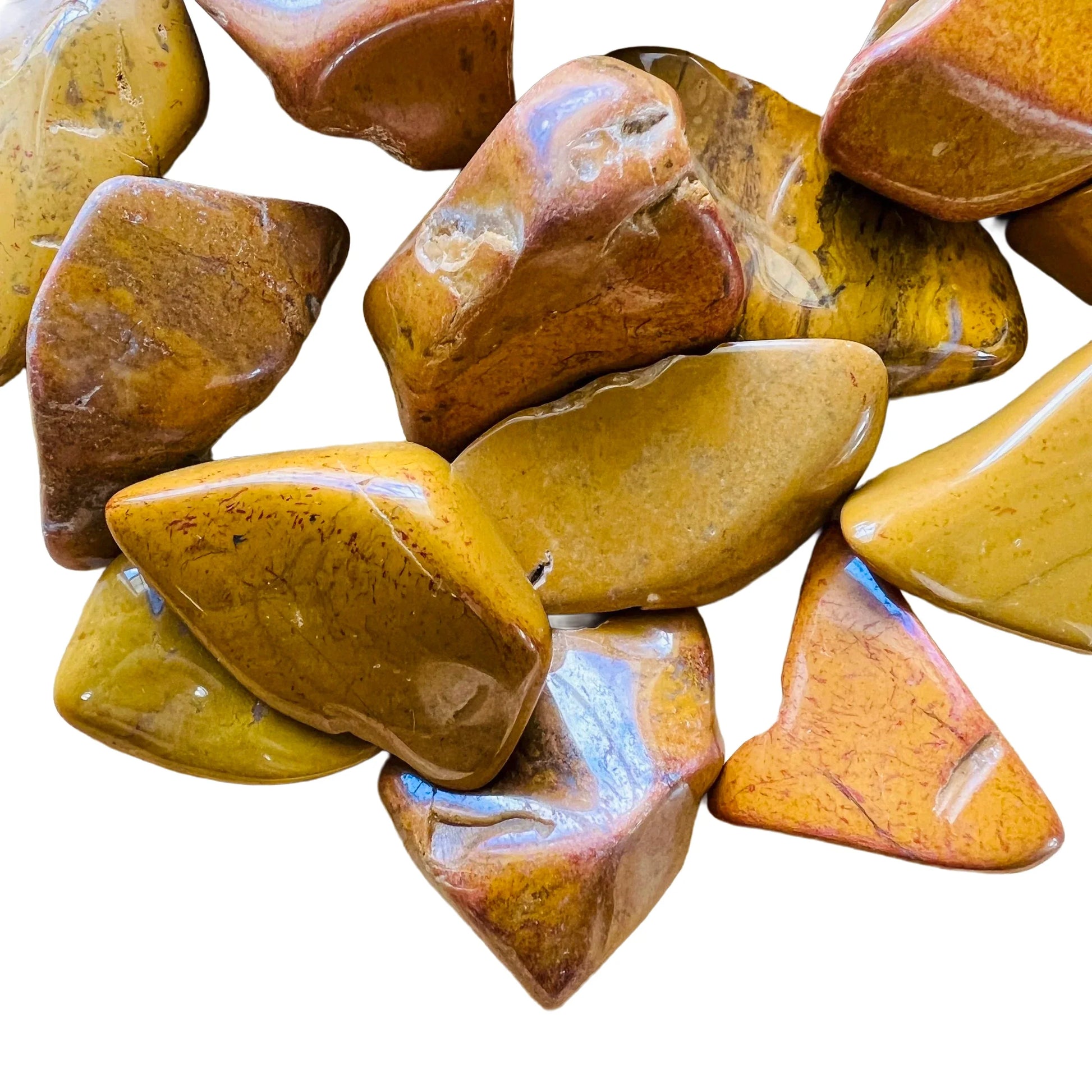 Macro view of Yellow Jasper tumbled stone, showing soft luster, Madagascar-sourced.