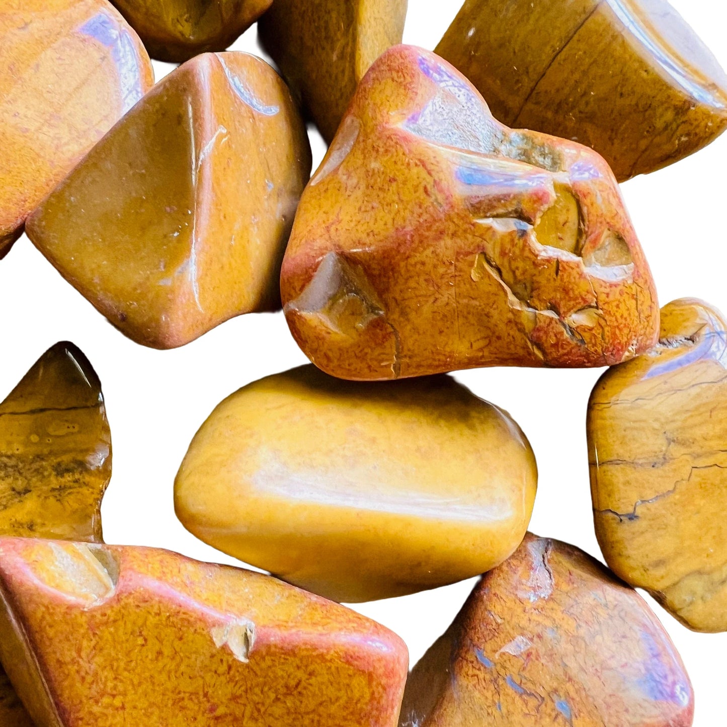 Side angle of Yellow Jasper tumbled stone, showing translucent edges, hand-selected from Sofia, Madagascar.