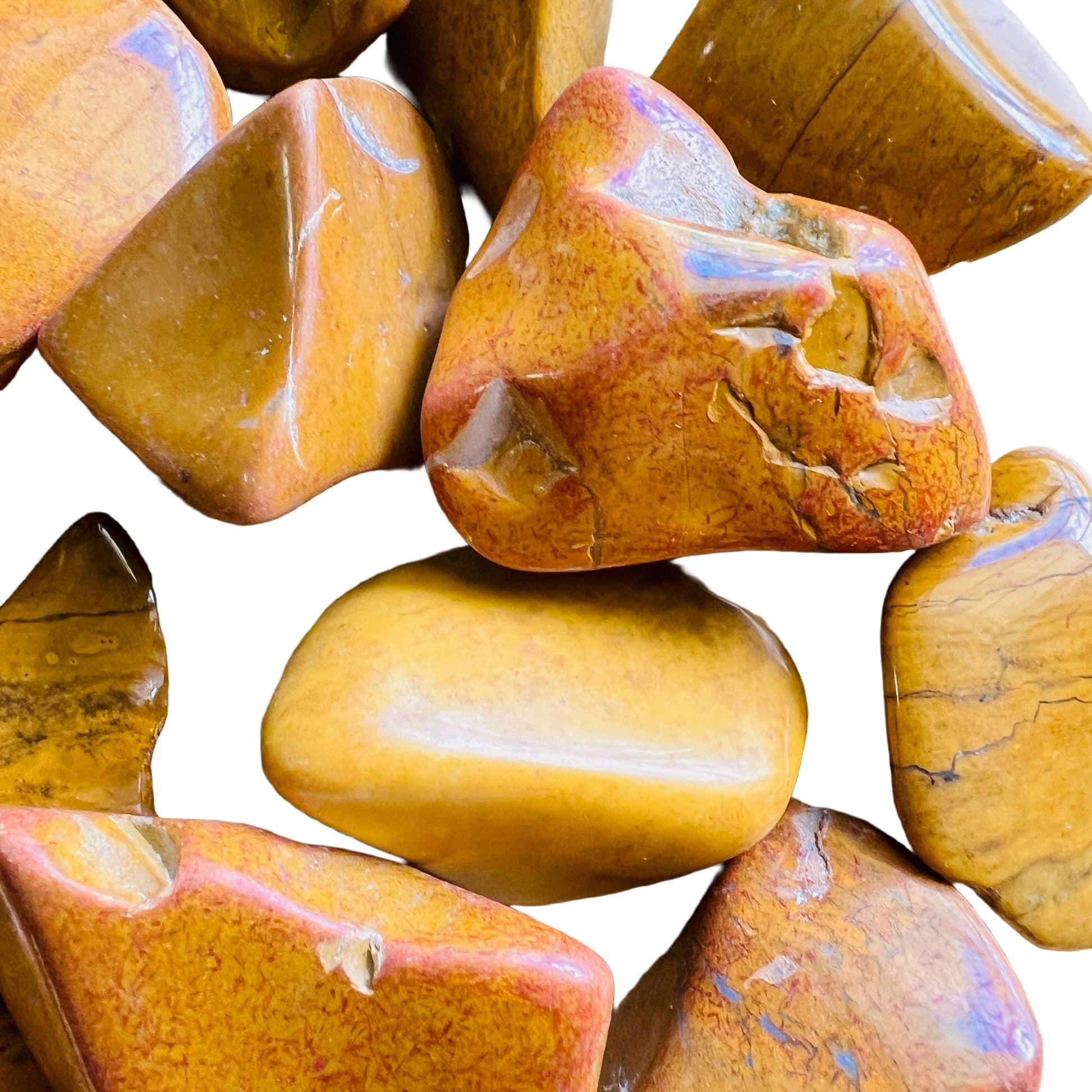 Side angle of Yellow Jasper tumbled stone, showing translucent edges, hand-selected from Sofia, Madagascar.