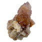 Single Cactus Spirit Quartz point standing upright, its lavender tip rising from a rust-toned iron-stained base still carrying host rock.