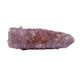 Side profile of an elongated Spirit Quartz point lying flat, showing how the druzy coating wraps the full length of the crystal.
