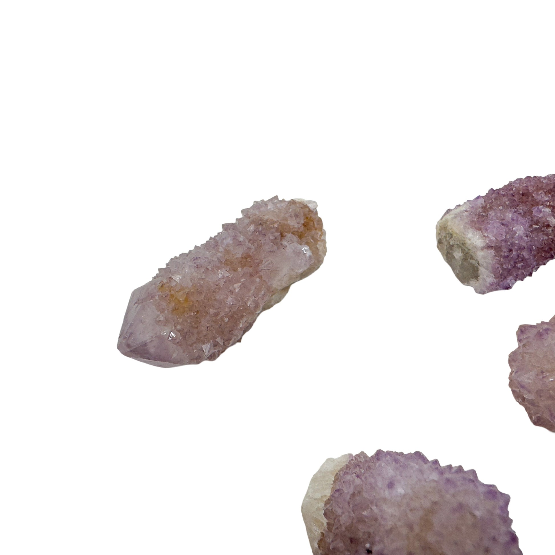 Spirit Quartz pieces spanning the color range you can expect, from near-clear through soft violet to rust-edged amber.