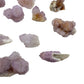 Size variation across a handful of Spirit Quartz pieces, with the smallest near half an inch and the largest close to one and a quarter inches.