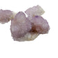 Two of the larger Spirit Quartz terminations shown up close, with clear violet tips above a dense collar of secondary growth.