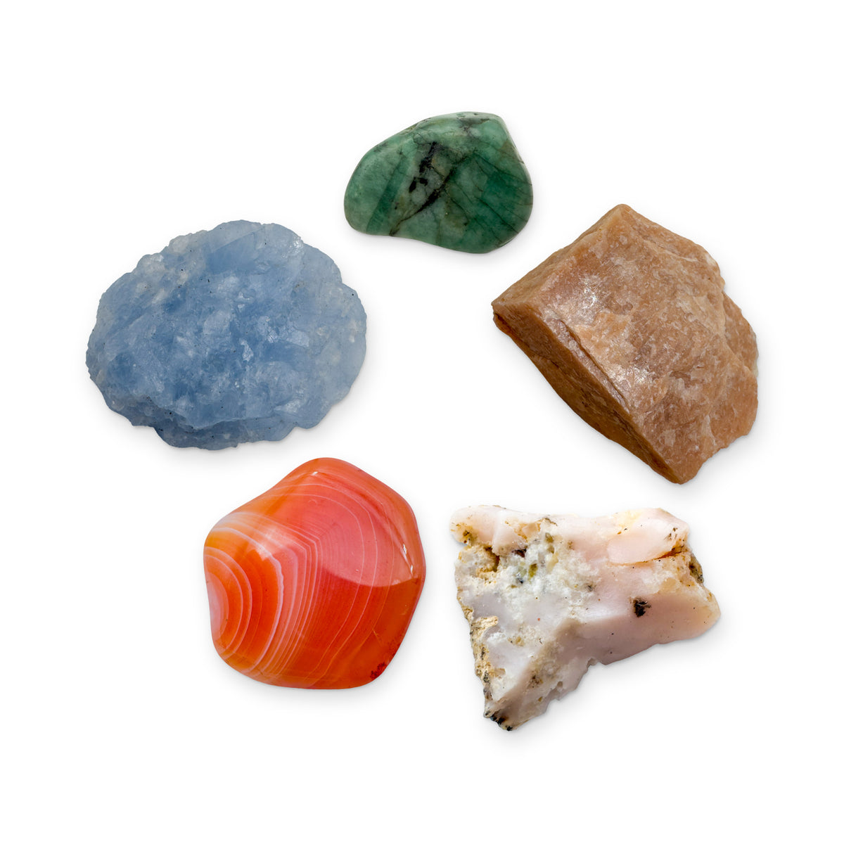 Cancer Crystal Kit: peach moonstone, pink opal, banded carnelian, blue calcite and emerald, shown together on white
