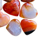 Top-down shot of Carnelian polished heart, showing matte finish.
