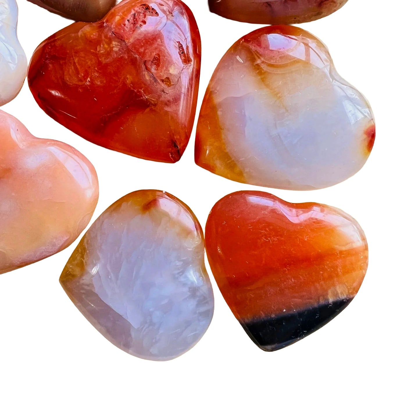 Top-down shot of Carnelian polished heart, showing matte finish.