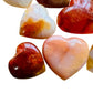 Alternate side of Carnelian polished heart, Madagascar-sourced, showing natural inclusions.