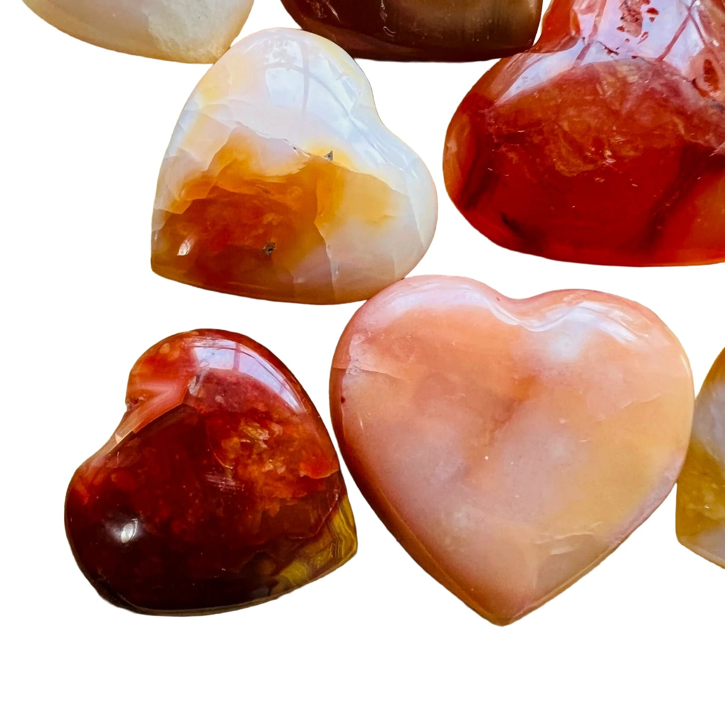 Alternate side of Carnelian polished heart, Madagascar-sourced, showing natural inclusions.