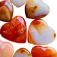 Three-quarter view of Carnelian stone, from Boeny, Madagascar, captured against a quiet backdrop.