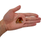 AA Grade Carnelian raw stone held in hand for scale, from Madagascar