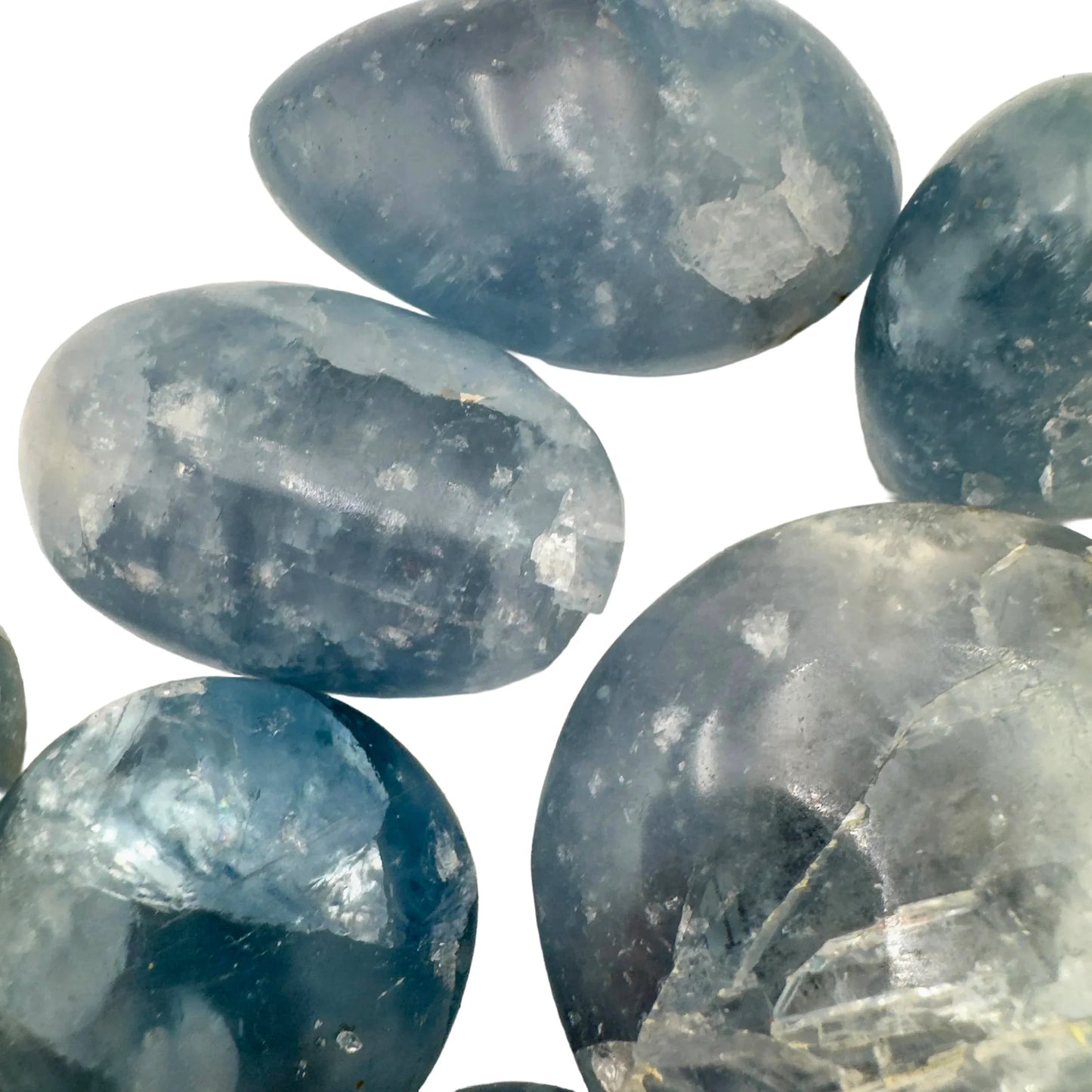 Grade aa celestite palm stone held in hand for size reference