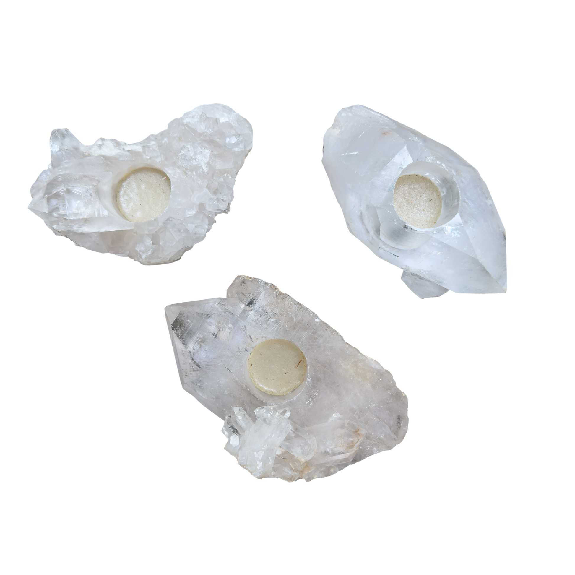 Three clear quartz candle holders from Brazil, natural crystal clusters with drilled tea light wells
