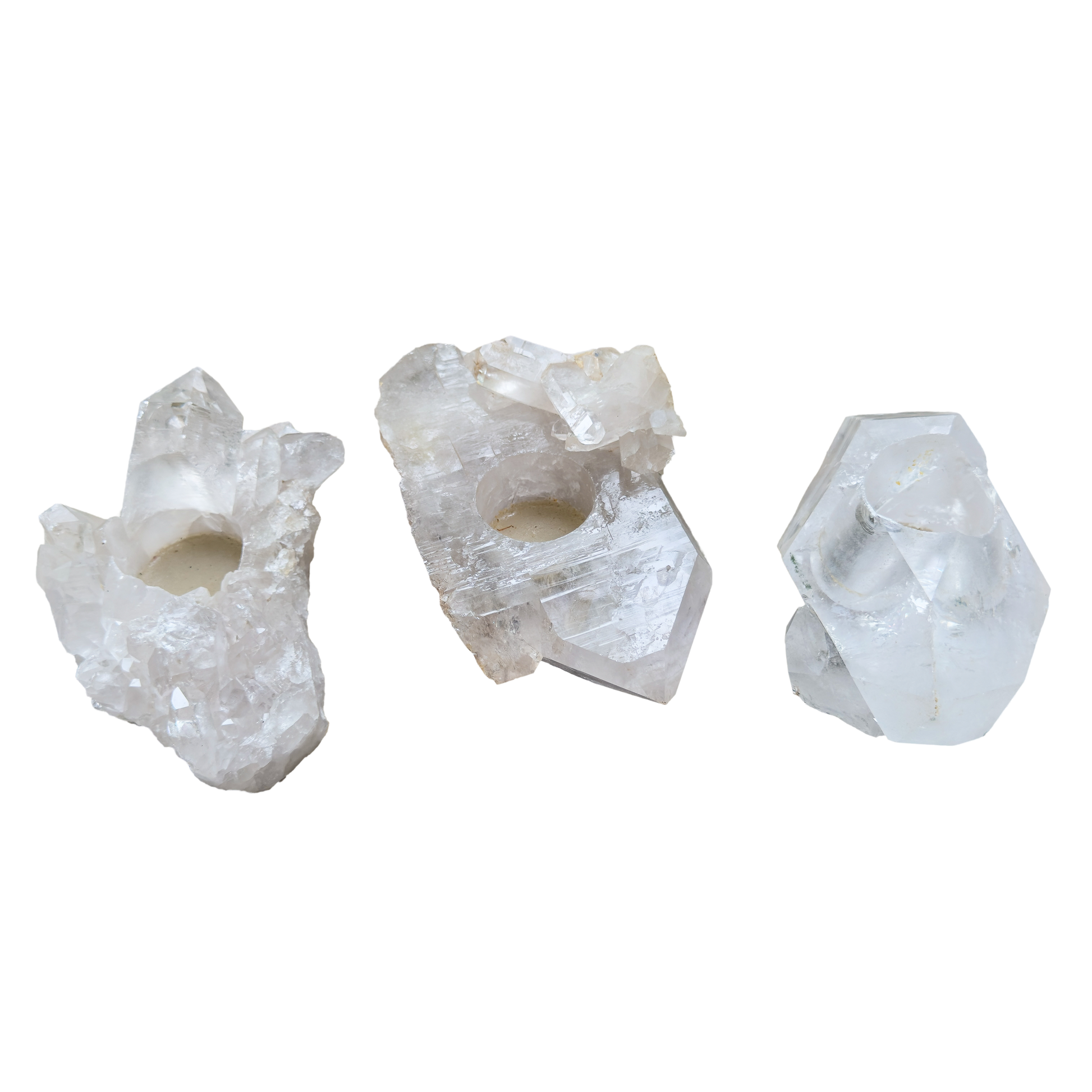 Clear quartz candle holders with visible terminations along the top and edges