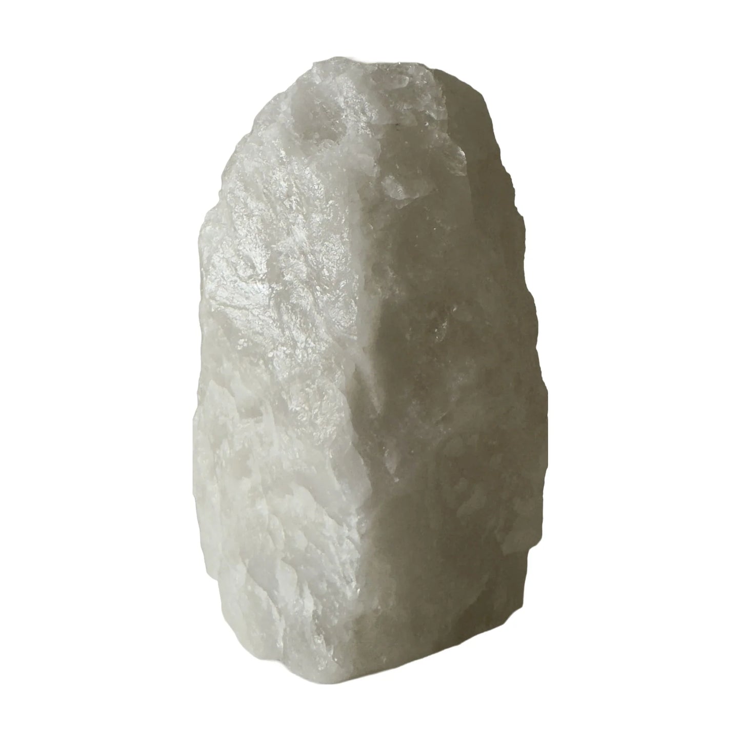 Clear quartz crystal lamp lit, soft warm glow through the stone, from Brazil