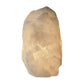 Clear quartz crystal lamp lit, internal structure visible in the warm glow
