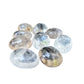 Close detail on a Clear Quartz palm stone showing internal veils and smoky zones