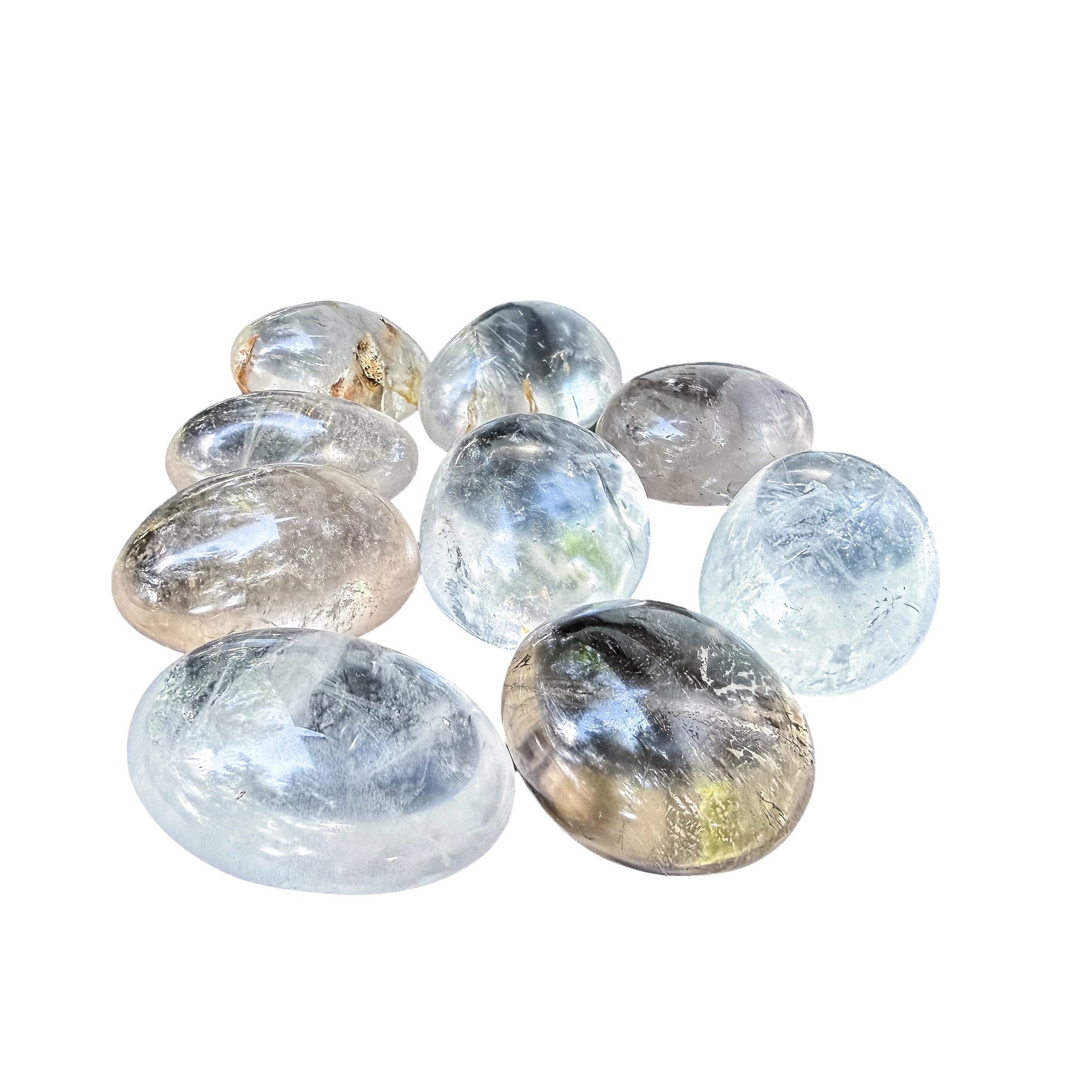 Close detail on a Clear Quartz palm stone showing internal veils and smoky zones
