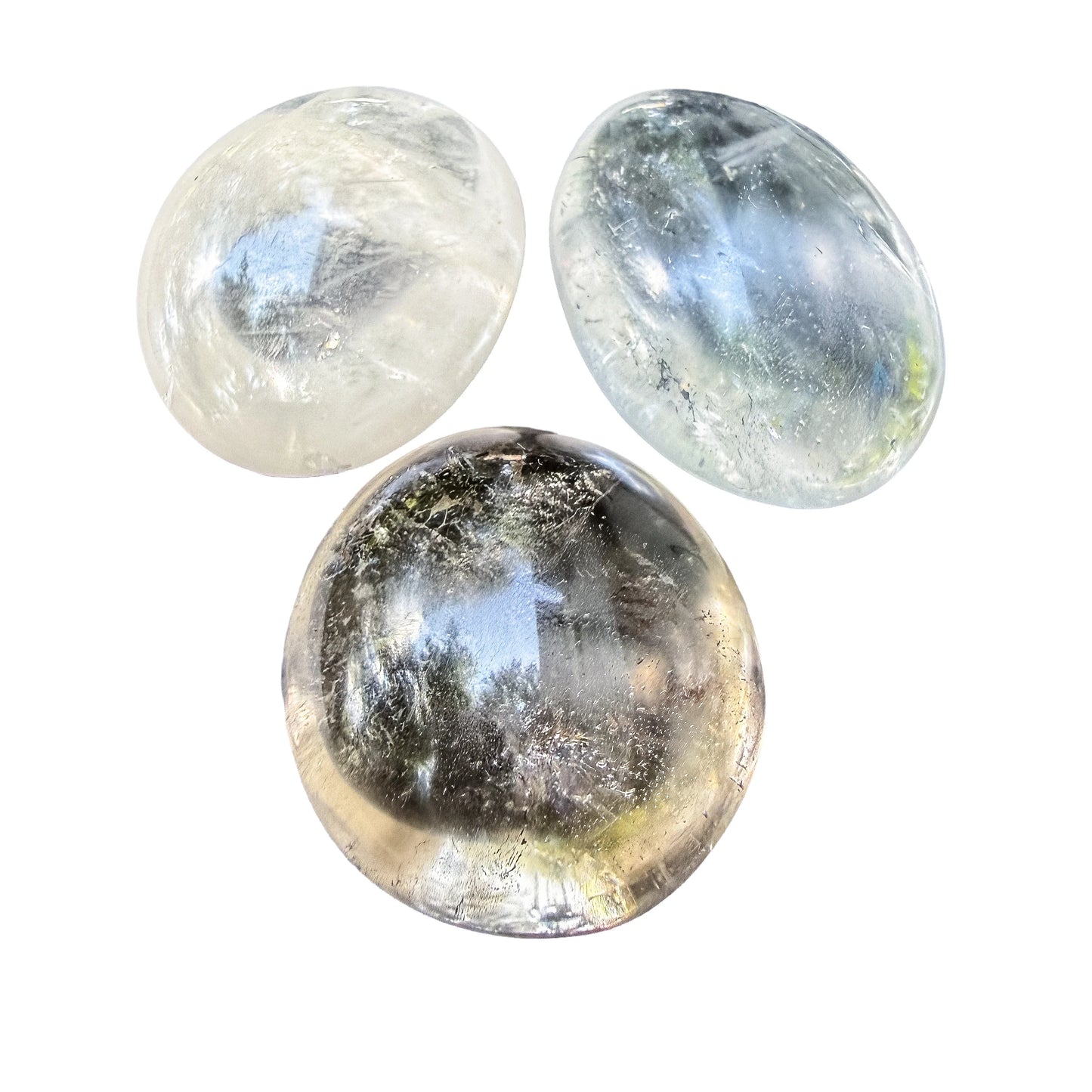 Overhead view of Clear Quartz palm stones polished to a flat oval