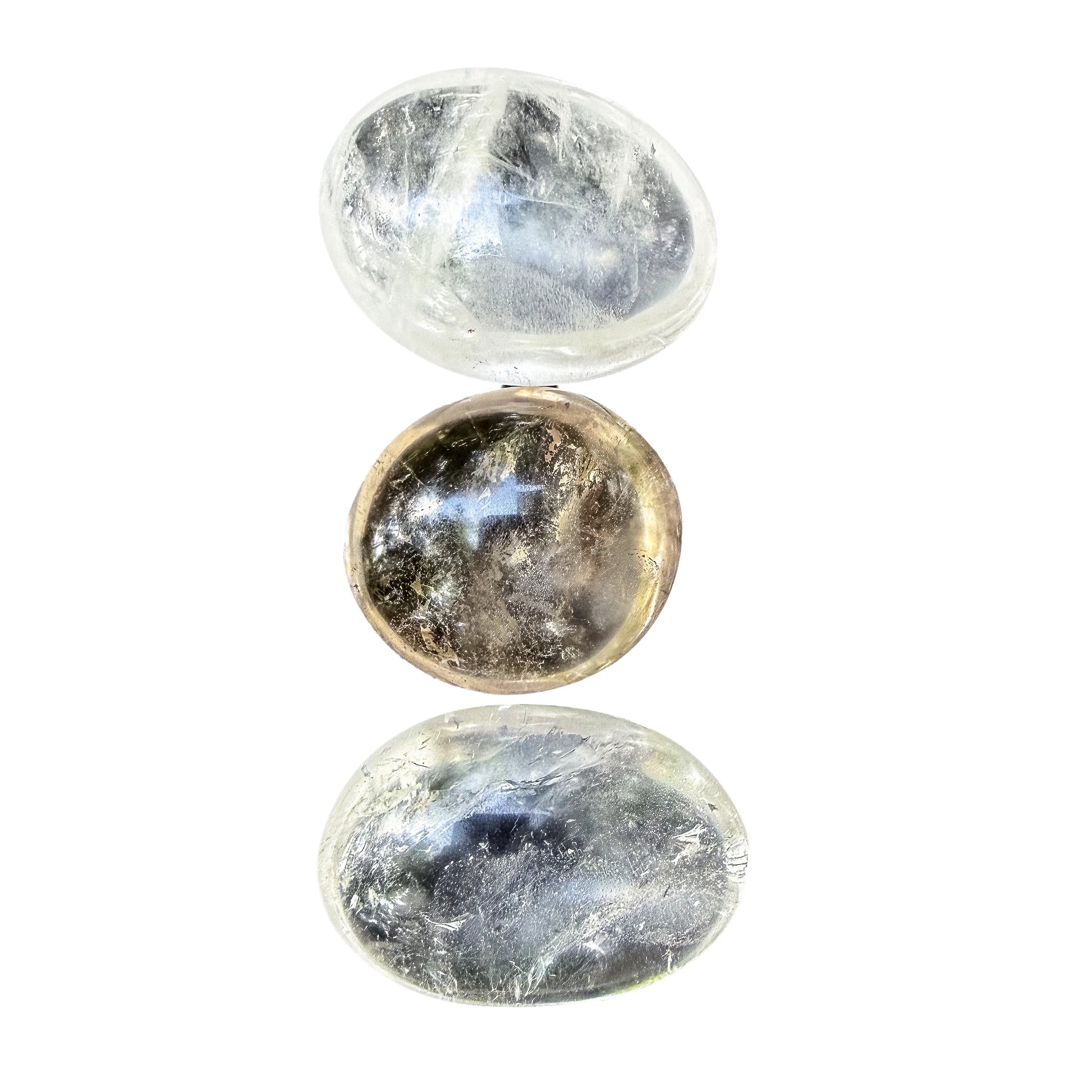 Side profile of a Clear Quartz palm stone showing its thickness in the hand