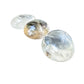 Light passing through the thinner edge of a Clear Quartz palm stone