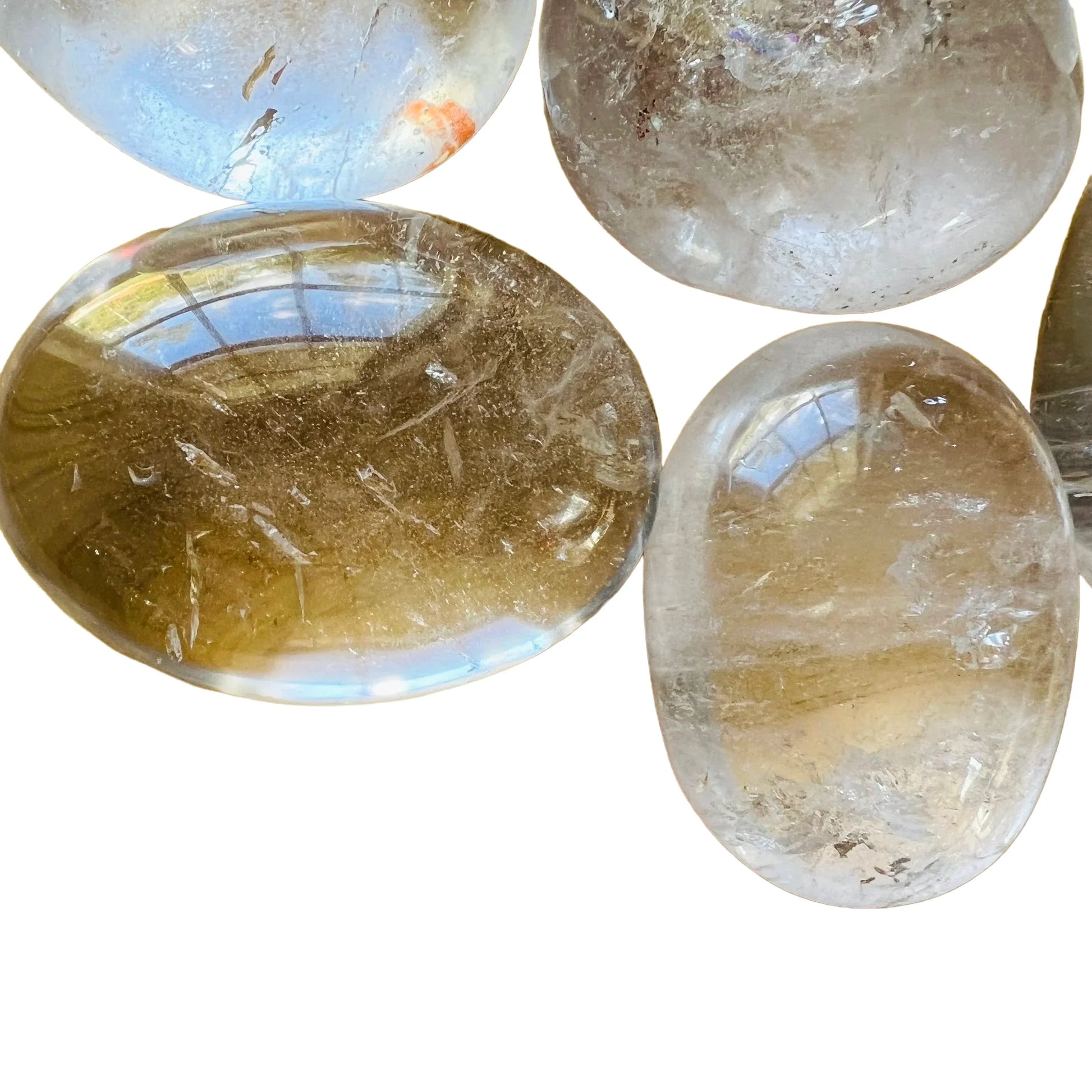 Looking down on Clear Quartz palm stone, from Vakinankaratra, Madagascar, showing natural inclusions.