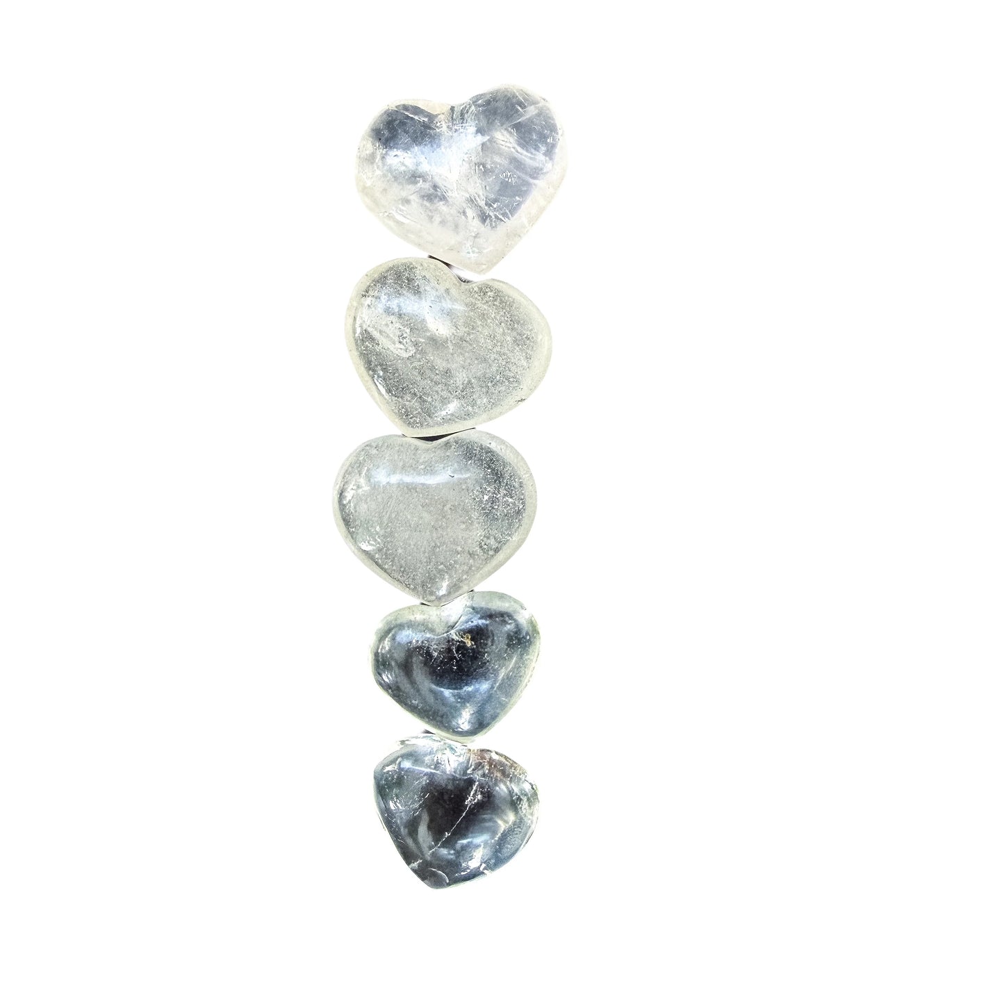 Light catching the polished face of a Clear Quartz heart from Vakinankaratra
