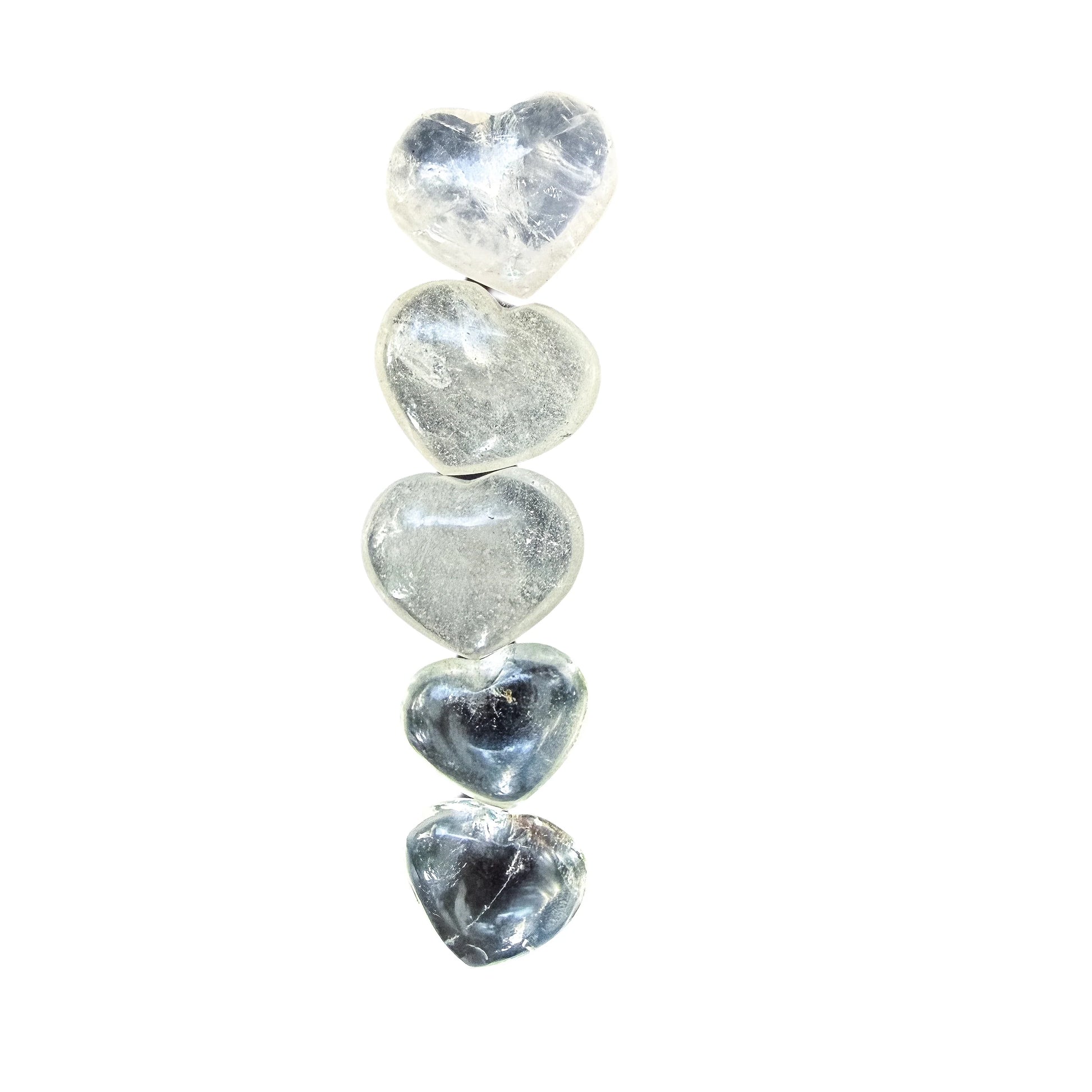 Light catching the polished face of a Clear Quartz heart from Vakinankaratra