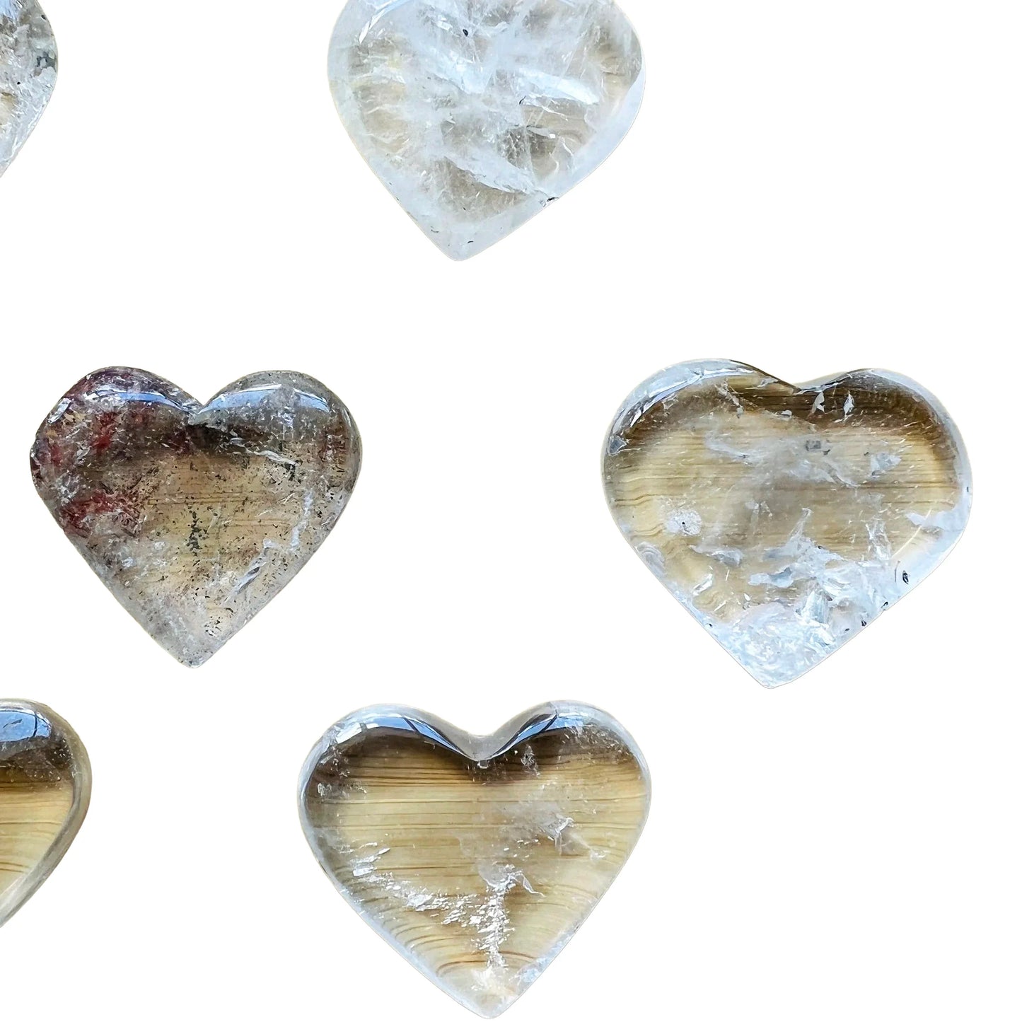 In-hand view of one Clear Quartz polished heart for scale, from Minas Gerais, Brazil.