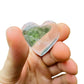 Held in palm of a Clear Quartz stone, from Minas Gerais, Brazil, with character of the piece on display.