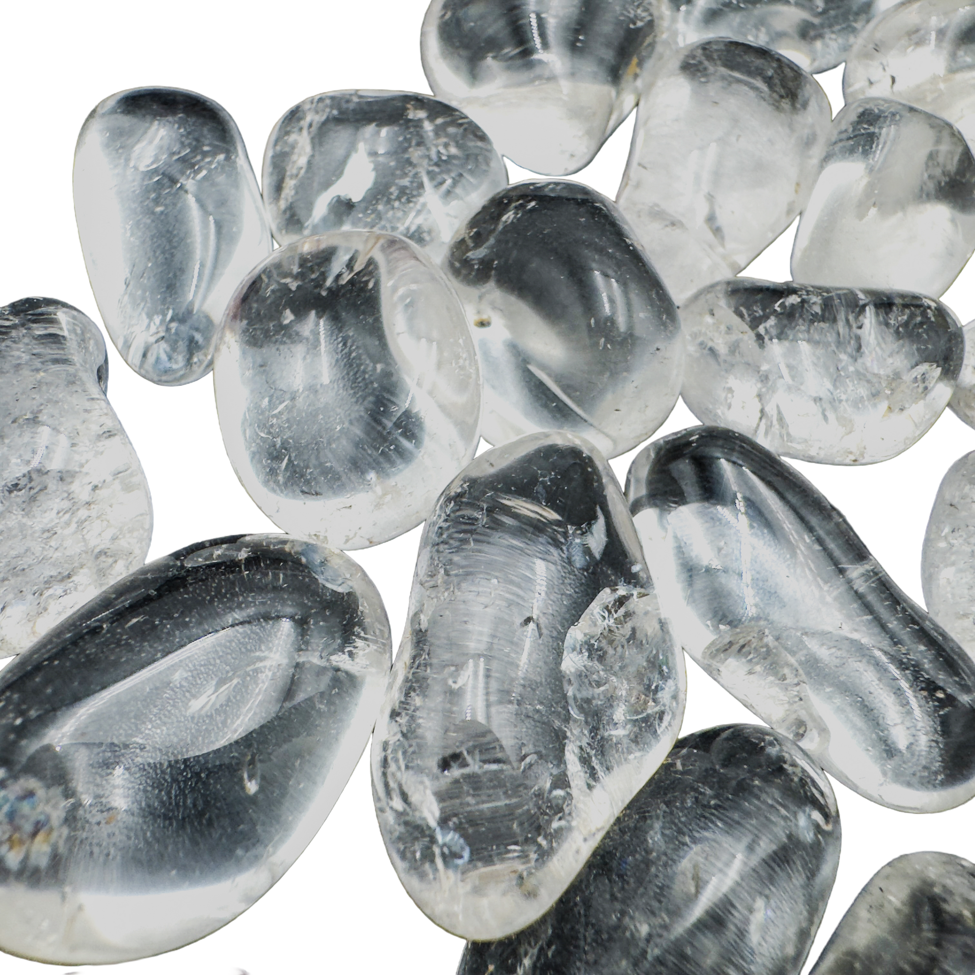 Close-up of polished Clear Quartz tumbled stones showing crystalline depth and natural inclusions, AAA grade Brazil